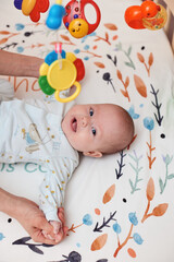 Baby massage. Mother doing gymnastics with newborn child