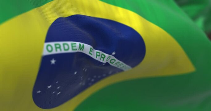 Close-up view of the Brazilian national flag waving in the wind.