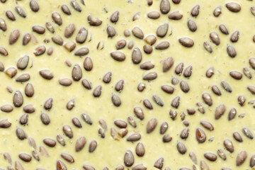 Texture of white chocolate with almonds, background of chocolate with nuts