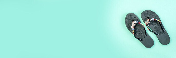flip flops on a blue background. Beach slippers close-up. Upcoming vacation. Banner for insertion...