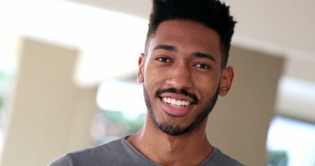 Mixed race young man, black ethnicity person smiling portrait face