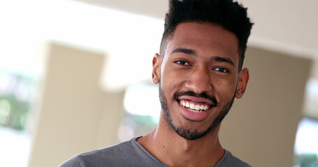 Mixed race young man, black ethnicity person smiling portrait face