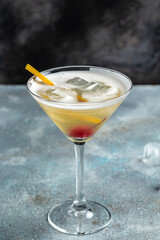 Classic daiquiri cocktail in glass on black background, Summer cold drink. cocktail allcohol. vertical image. top view. place for text