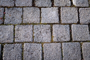 Abstract background of old cobblestone pavement view from above