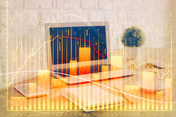 Stock market graph and table with computer background. Multi exposure. Concept of financial analysis.
