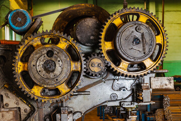Machine gear close-up. Repair and maintenance of production equipment. Lubrication of gears in...