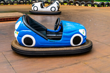 Electric bumper cars or dodgem cars at the amusement park