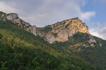 Fototapeta na wymiar Scenic summer morning landscape panorama of rocky mountain ridge and forest in the Boulzane river valley near Gincla, Aude, France