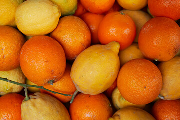 A basket full of citric fruits like oranges and lemons. Healthy fruit food.