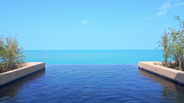 Resort rooftop infinity pool and overlooking ocean idyllic horizon