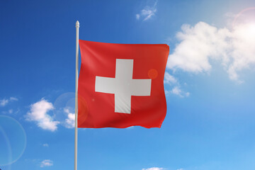 Flag of Switzerland on blue sky. 3d illustration.