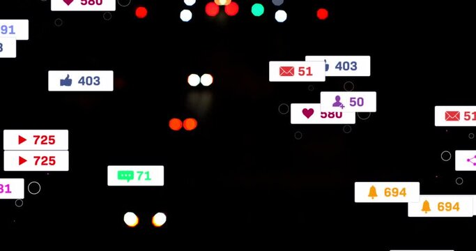 Animation of social media icons and numbers over out of focus city lights