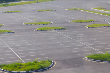 New car parking with markings, lawn and new asphalt, top view