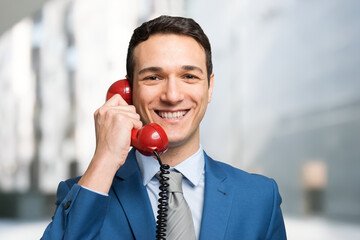 Businessman talking on a vintage phone