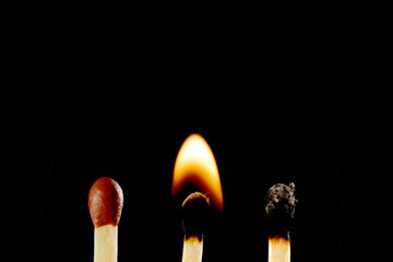 Three matches in different stages: to be lit, burning, burnt.
