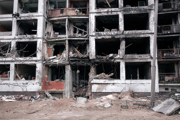 Destroyed house after being hit by a rocket. Residential building after a fire from an aerial bomb