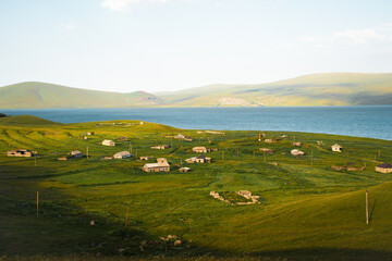 Obraz premium Abandoned Vladimirovka village by Paravani lake in summer