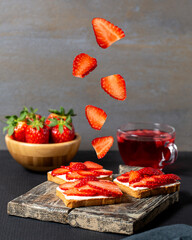 Delicious healthy breakfast toasts with cream cheese and fresh organic fruits and berries