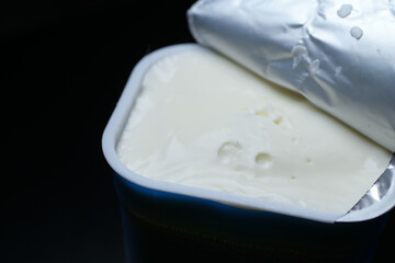fresh yogurt in a bowl on table 