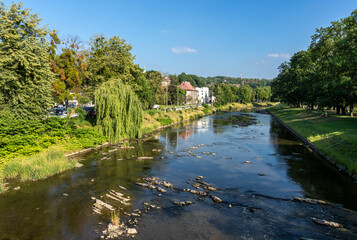 Fototapeta premium The Olza River as seen from the Friendship Bridge in Cieszyn