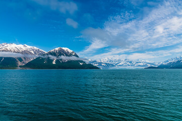 A view past the headlands of Disenchartment Bay toward the Hubbard Glacier, Alaska in summertime