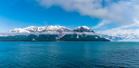 A view of low level cloud on the sides of Disenchartment Bay, Alaska in summertime - Powered by Adobe
