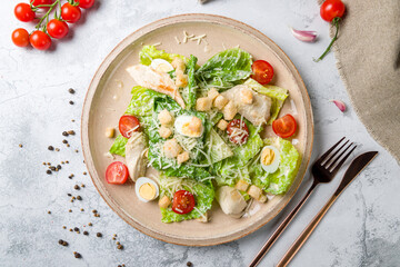 Salad caesar with chicken on white plate top view - obrazy, fototapety, plakaty