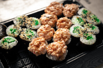Delicious sushi rolls on the table. Traditional Japanese sushi is ready to eat