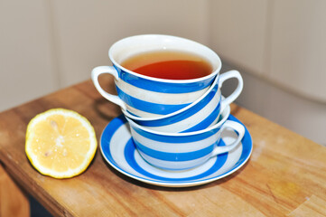 close up of cup of tea with blue stripes at home ,teatime and relax
