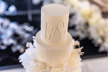 Beautiful wedding cake decorated with white flowers