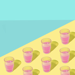 Creative layout of tasty purple cocktails. Fresh drink and summer party composition. Abstract drink idea.