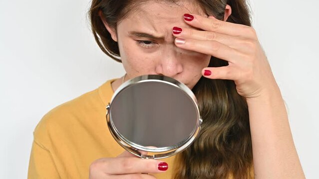 Asian Woman Worried About Her Acne And Wrinkled Occur On Her Face. Wrinkles Are Creases, Folds, Or Ridges In The Skin. They Naturally Appear As People Get Older.