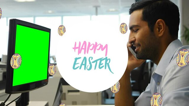 Animation of easter eggs and happy easter over biracial man using computer with copy space