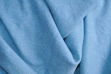 close up of blue blanket on the sofa in living room