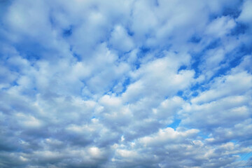 White fluffy clouds on a bright blue sky