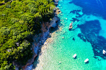 Fototapeta na wymiar Corfu island, Greece . Aerial drone view of beautiful double beach with turquoise clear waters Limni beach Glyko near Paleokastritsa.
