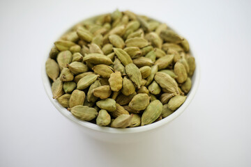 Cardamom on a white background. Pile of Indian Aromatic Spice