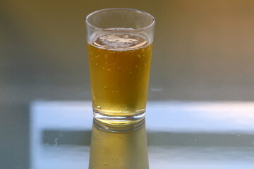 On the table in a mug fresh , light beer .