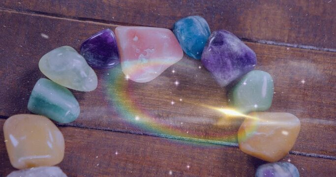 Animation of stars and galaxies moving over stones on wooden surface