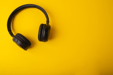 Wireless headphones on a yellow background