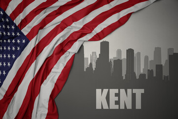 abstract silhouette of the city with text Kent near waving colorful national flag of united states of america on a gray background.