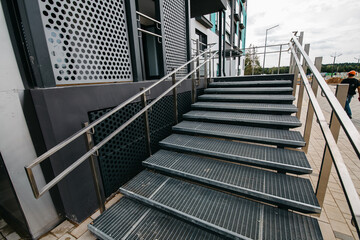 Wheelchair ramp with lift at the entrance to a residential apartment building