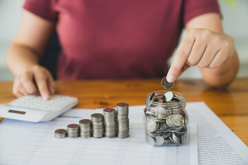 Woman with coin stack. Financial Growing savings concept. Saving money by hand putting coins money accounting planning