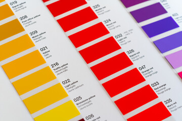 Vibrant colors swatches - adhesive film - with colour names in English, German and French, closeup detail