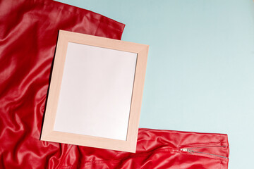 Mockup of a white blank canvas on top of a red cloth