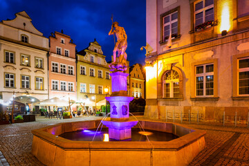 Fountain of the Neptune on the old town of Jelenia Gora at night, Poland
