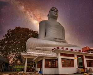 kandy sculpture giant buddha Sri Lanka under night sky stars galaxy Milky Way 
