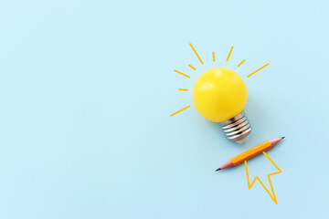 Obraz na płótnie Canvas Education concept image. Creative idea and innovation. light bulb metaphor over blue background