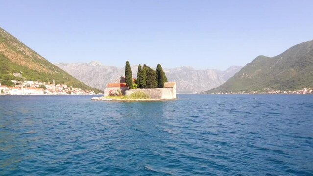 Island of St. George near town Perast in Bay Kotor, Montenegro. Beautiful high mountains near sea in Montenegro. Place for sea tourism, sports, recreation