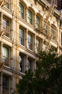 Cast iron facades of Soho loft buildings with fire escapes. Soho Cast Iron Building Historic District, Lower Manhattan, New York City